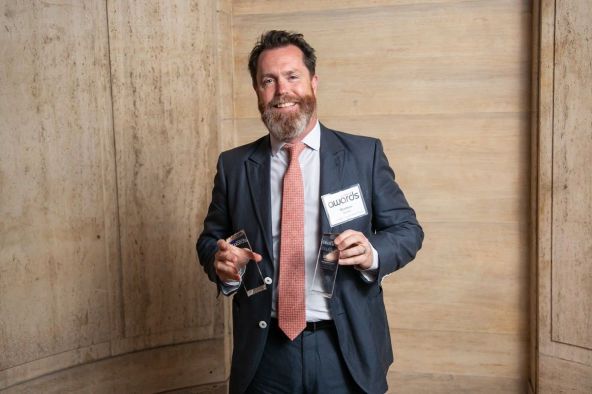 CEO Matt Rembe holding award