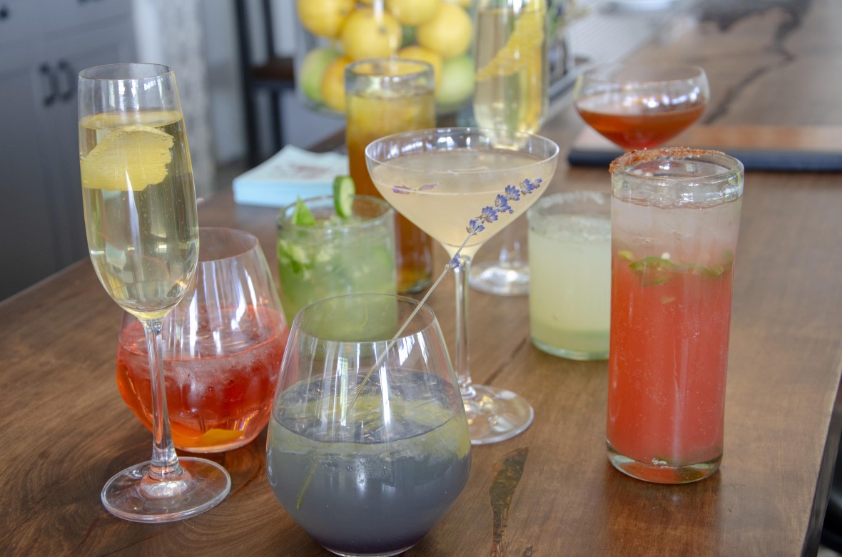 Colorful cocktails in many different glasses on the bar at Campo