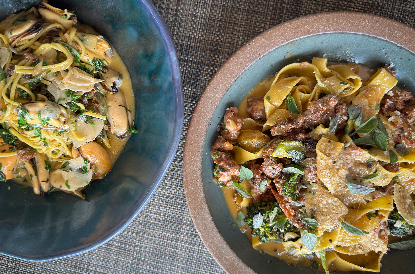 two separate bowls of pasta